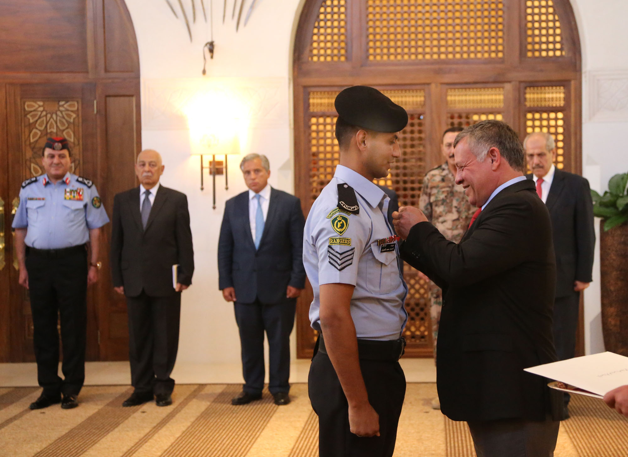 King decorates officers who helped arrest suspected terrorist